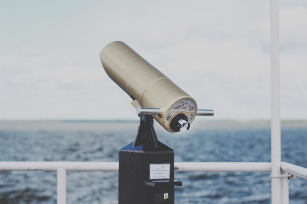 Telescope overlooking a vast ocean scene on a clear Brisbane day.